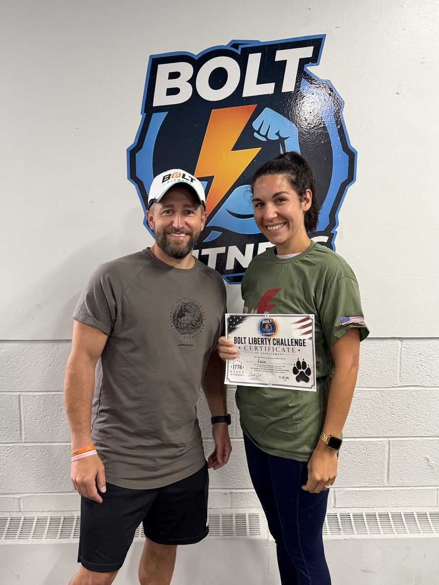 Bolt Fitness member receiving a Bolt Liberty Challenge certificate