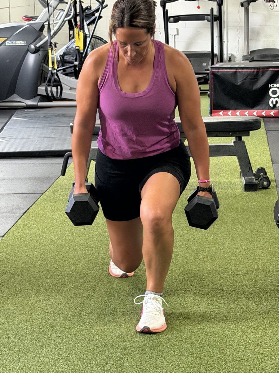 Bolt Fitness member doing dumbbell lunges